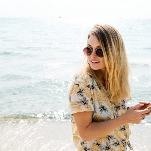 woman on the beach wearing sunglasses