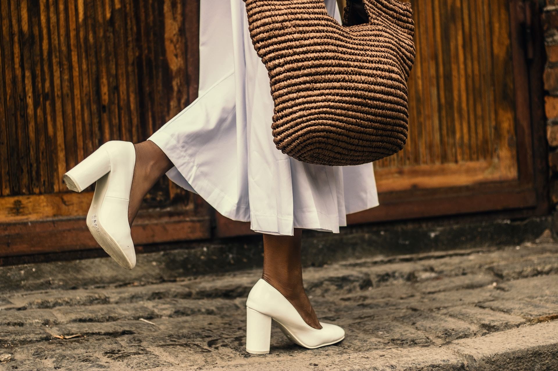 woman in white block heels