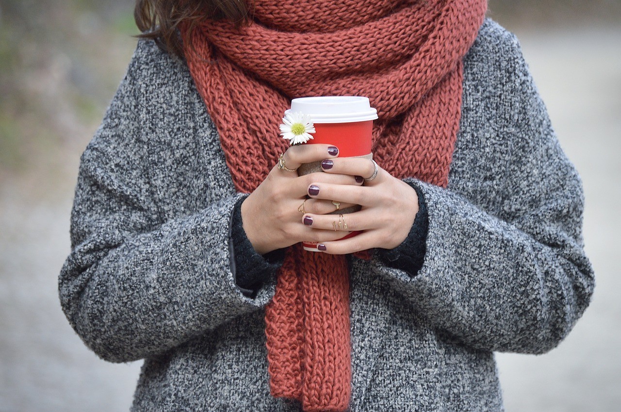 woman wearing a winter sweater and a scarf