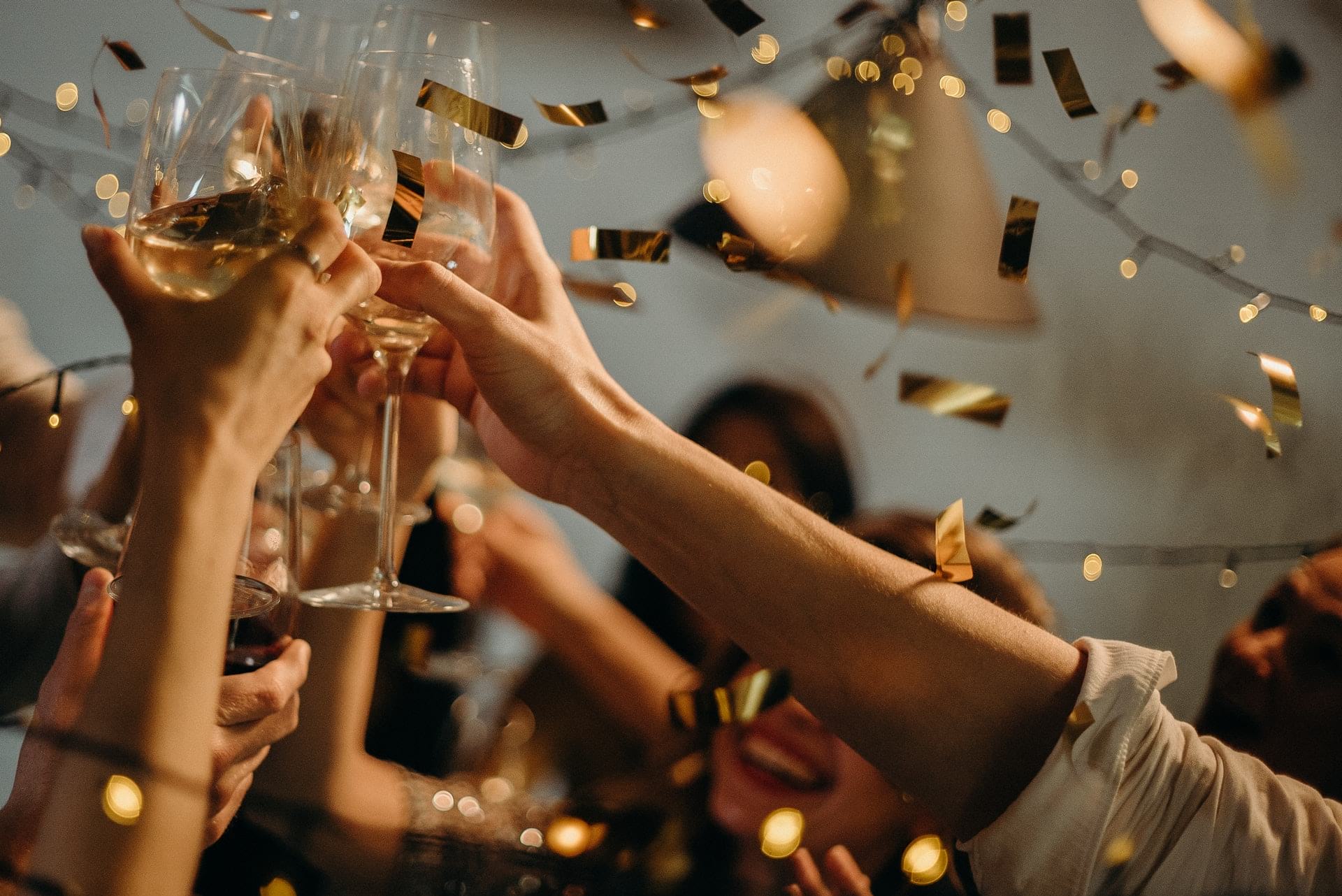 people toasting with confetti