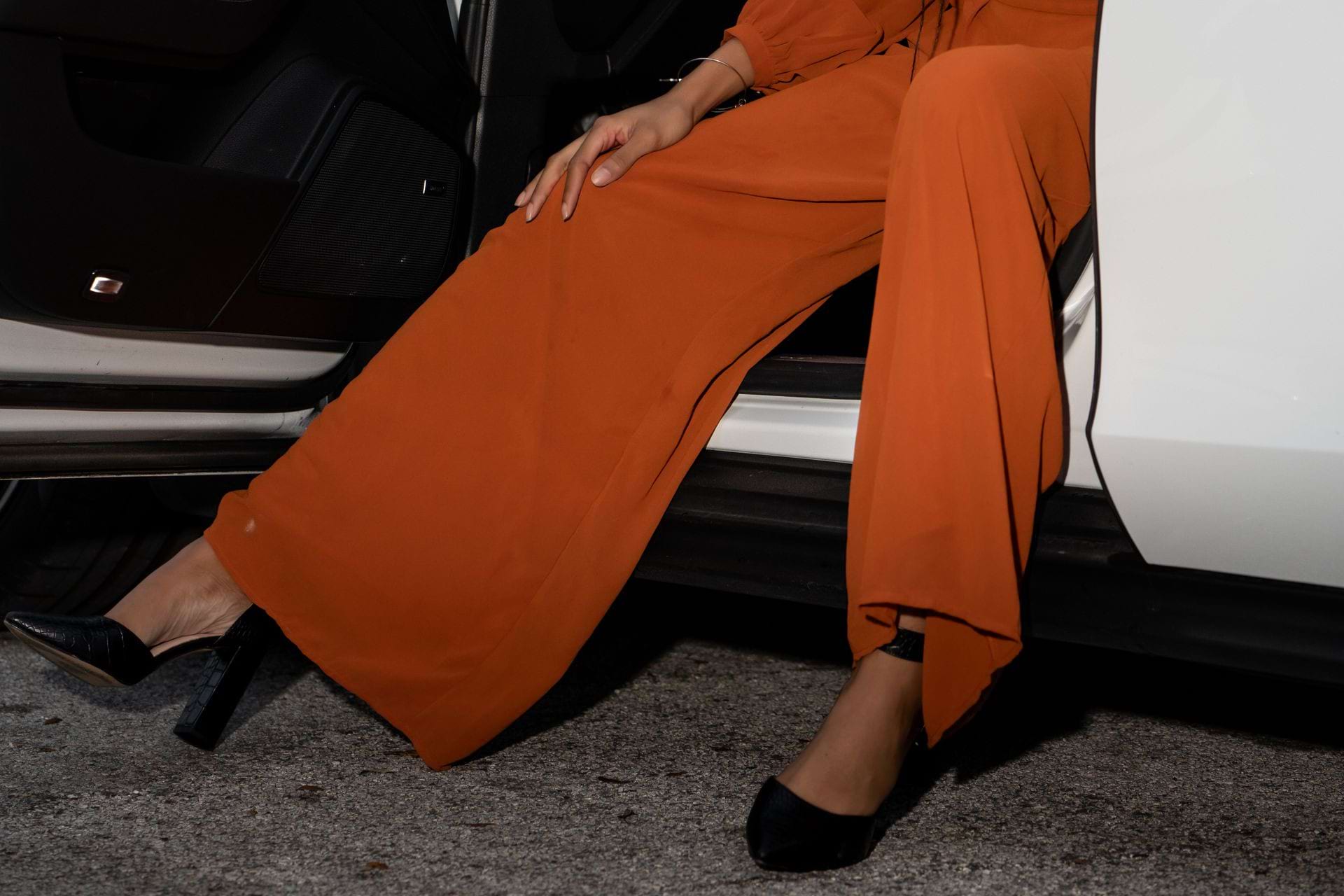 woman in orange balloon pants
