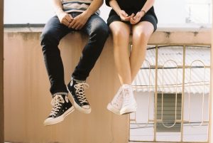 boy and girl wearing sneakers